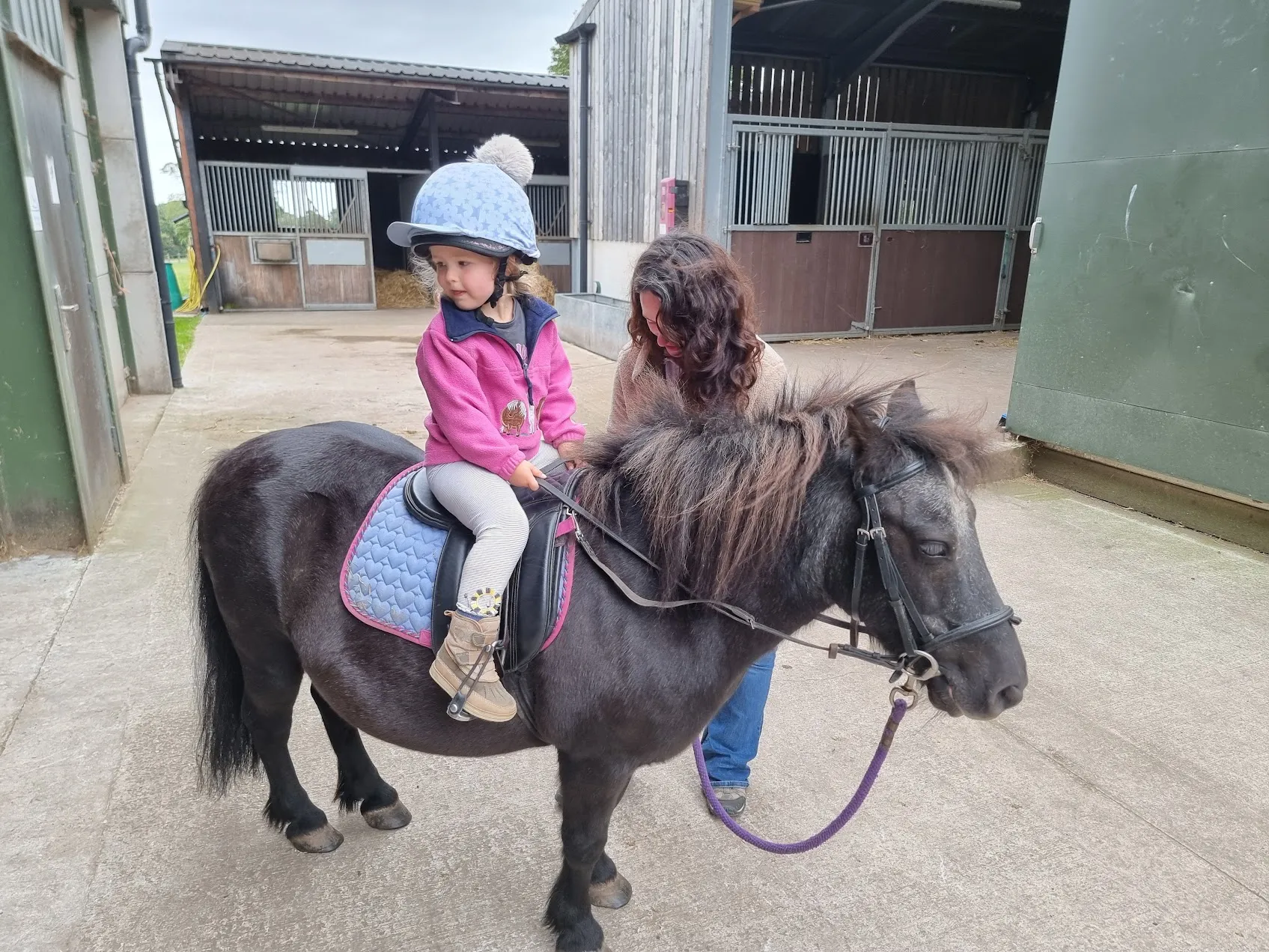 Rose test riding Orville the Shetland pony